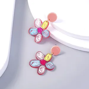 Acrylic colorful flower earrings detail shot, playful painted design for women fashion accessories.