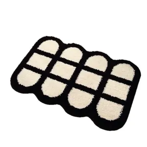 Modern black and white tufted area rug with geometric wave pattern for cozy bedroom floor decor.