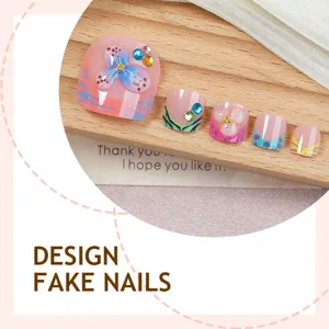 Short press-on toenails featuring tropical floral designs and colorful rhinestones for summer.