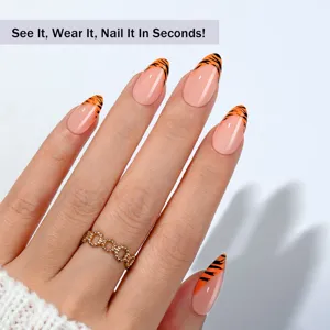Stunning almond press-on fake nails featuring trendy French animal print and elegant design.