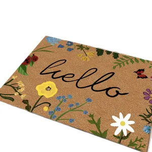 Paillasson en fibre de coco florale avec texte hello, tapis d'entrée résistant.