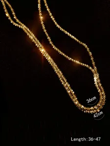 Sparkling starlight gold chain necklace detail shot showing double layered design and length.