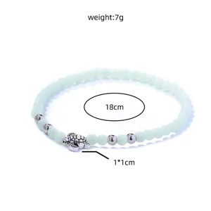 Leuchtendes Perlen Schildkröten Armband mit elastischer Kordel und Metall Anhänger.