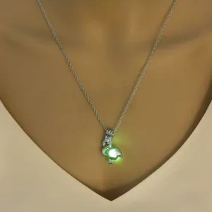 Glow in the dark swan pendant necklace, luminous fashion jewelry for women daily wear detail.