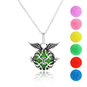 Hollow angel wing pendant necklace detail showing silver carving and multi-color aroma balls.