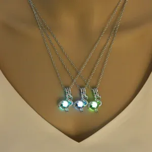 Silver multi-layer chain flamingo cage necklace with luminous glowing bead pendant fashion jewelry.
