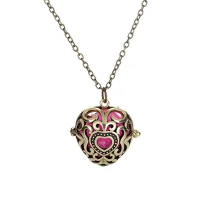 Vintage bronze hollow heart locket aromatherapy ball pendant necklace with pink core chain