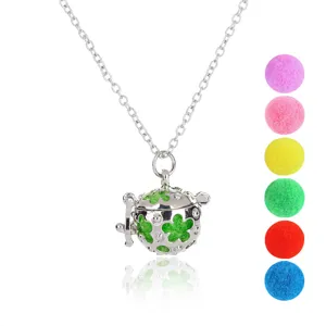 Detailed view of silver-colored aromatherapy locket necklace with colorful refill balls.
