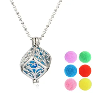 Hollow aromatherapy ball pendant necklace with multi-color fluffy pom-pom diffuser refills.