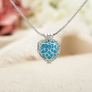 Vintage hollow heart cage pendant necklace with blue glowing stone or aromatherapy ball choker.