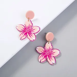 Pink cherry blossom acrylic dangle earrings close-up, sweet floral design for daily wear.