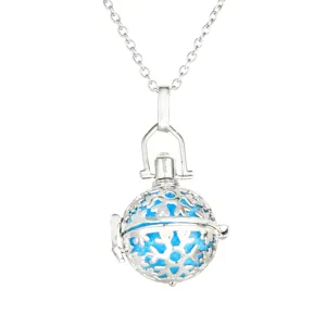 Detailed view of the vintage silver aromatherapy locket necklace with blue snowflake core.