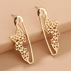 Gold safety pin butterfly earrings detailed shot, elegant hollow floral design for women.