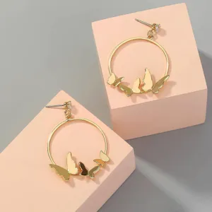Gold hoop earrings featuring delicate butterfly charms for women fashion style everyday wear accessory