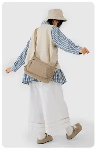 Casual multi-pocket nylon crossbody bag for women, large capacity stylish daily shoulder bag.
