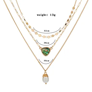 Élégant collier à trois couches dorées avec pendentifs perle et coquillage, 32-50cm.