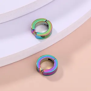 Colorful rainbow clip-on hoop earrings detail shot showcasing vibrant gradient metal finish.