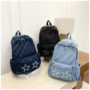 Washed denim canvas backpack for women, large capacity school bag with star patch and chic print.