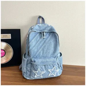 Water-washed denim backpack for women, large capacity casual school bag with star patches.
