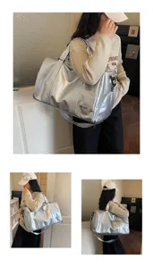 Silver metallic travel duffel bag for women, large capacity gym sports shoulder bag with strap.