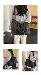 Detail view of the large capacity black PU leather travel tote bag showing multi-way wear.