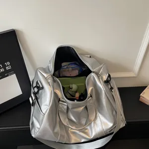Large capacity silver metallic travel duffel bag for sports, fitness, and yoga, main view.