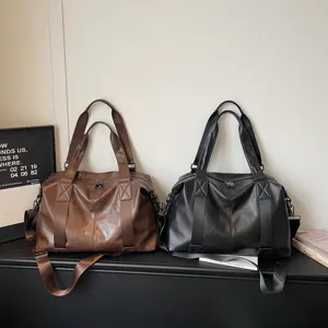 Large capacity PU leather travel duffel bag, casual tote shoulder bag for short trips.