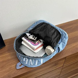Casual denim backpack for women, large capacity vintage canvas school bag for daily commute.