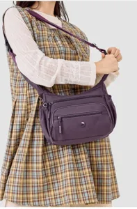 Women's casual nylon crossbody bag, solid color multi-pocket shoulder hobo bag for daily use.