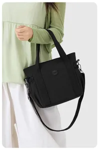 Black nylon tote bag for women, large capacity casual shoulder bag with crossbody strap.