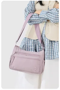 Casual nylon crossbody bag with multi pockets and large capacity for women daily commuting and travel.