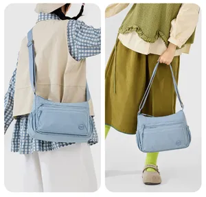 Lightweight nylon crossbody bag with multi pockets, casual shoulder bag detail view.