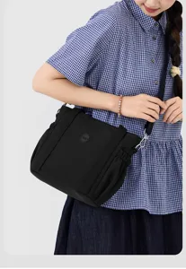 Casual nylon shoulder bag for women, large capacity minimalist crossbody tote for daily commute.