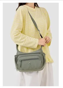 Casual nylon crossbody bag with multi pockets and adjustable strap for women daily use.