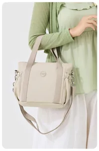 Casual large capacity nylon tote bag for women, stylish lightweight shoulder crossbody handbag.
