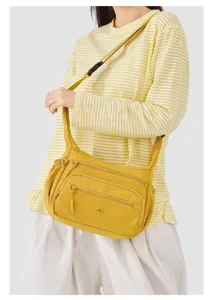 Stylish yellow nylon crossbody bag for women with multi pockets and large capacity daily use.