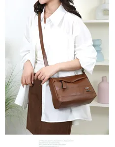 Brown soft leather women shoulder bag detail shot, large capacity casual crossbody handbag.