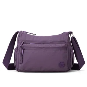 Purple multi-pocket nylon crossbody bag for women, lightweight and casual daily use.