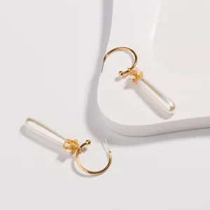 European fashion C-shaped ear hooks with hand-wound copper wire and pearl long earrings.