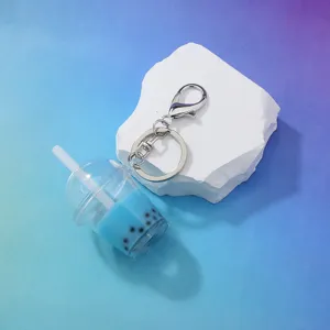 Cute acrylic blue boba milk tea cup keychain charm with metal keyring for bags and keys.