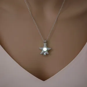 Close-up view of the luminous starfish pendant necklace, highlighting delicate details.