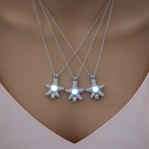 Glow-in-the-dark starfish pendant necklace detail shot, elegant silver chain jewelry accessory.