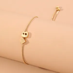 Exquisite minimalist gold sliding letter bracelet with a lovely heart charm for women daily.