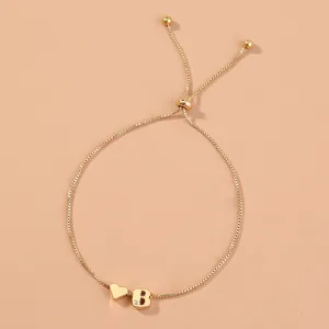 Gold box chain adjustable bracelet with heart and letter B charms for women fashion jewelry.