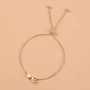 Gold slider box chain bracelet with heart and letter E charm, adjustable everyday jewelry.