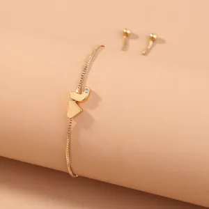 Gold letter J slider bracelet with heart charm and crystal, adjustable dainty chain jewelry.