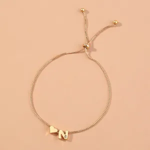 Gold adjustable box chain bracelet with heart and letter N charms for women daily wear.