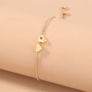 Gold box chain double heart adjustable bracelet detail view, elegant fashion accessory
