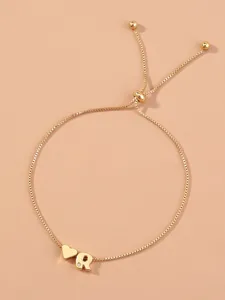 Gold adjustable box chain bracelet featuring a cute heart charm and letter R crystal detail.