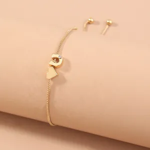 Gold adjustable letter charm bracelet featuring a delicate box chain and heart pendant.